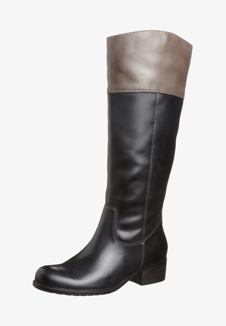 Bottes en cuir hauteur genou avec une partie inférieure noire et un revers supérieur marron contrastant. Bout rond, petit talon bloc et coutures visibles.