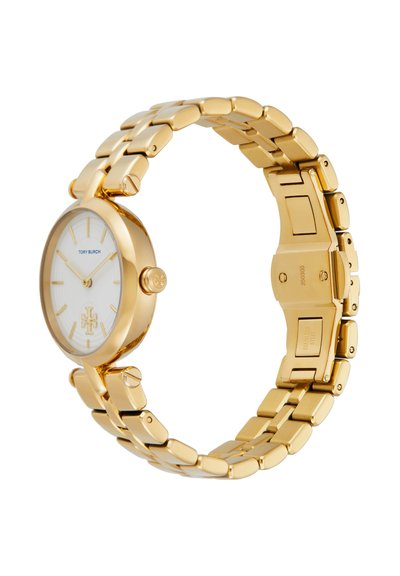 Tory Burch armbåndsur i rustfrit stål med gyldent skær, hvid urskive, minimalistiske markeringer og ledet armbånd med lås.