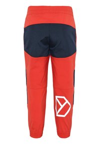 Red and navy athletic pants with a tapered design, elastic waistband, and a white logo on the lower left leg. Smooth texture with contrast panels.