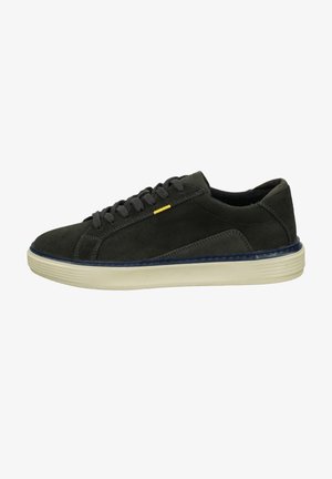 Dark grey suede sneaker with rounded toe, contrasting navy sole, lace-up design, and a small yellow accent detail on the side.