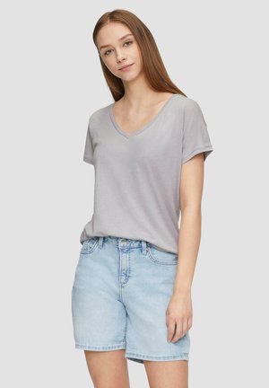 Gray V-neck t-shirt made of soft cotton with short sleeves, paired with light blue denim shorts featuring front pockets and a straight cut.