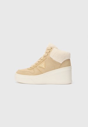 Beige wedge sneaker with fur collar, lace-up front, and white platform sole, displayed on a plain light gray background.