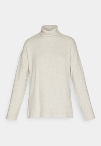Turtleneck sweater in light beige, featuring long sleeves, ribbed texture, side slits, and a relaxed fit. Made from a soft knit material.