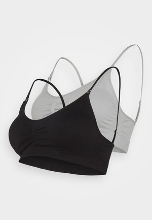 Black and gray seamless bralettes with adjustable straps, soft texture, and gathered detailing at the center, featuring a stretch fabric construction.