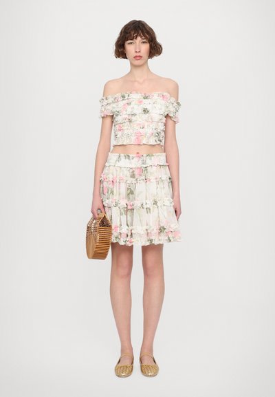 Off-the-shoulder floral crop top and matching tiered skirt in pastel colors, with ruffled accents and a lightweight, textured fabric.