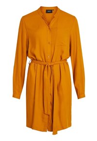Robe chemise jaune moutarde avec des manches longues, fermeture à bouton, poche poitrine et une ceinture assortie à la taille. Finition en tissu lisse.