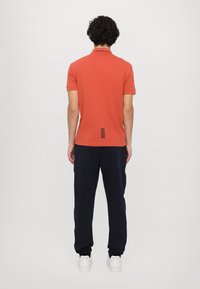 EA7 Emporio Armani TRAIN CORE - Polo shirt - ginger spice