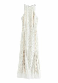 Vestido blanco sin mangas con patrones geométricos de encaje, lados abiertos y un diseño largo y fluido con escote redondo.