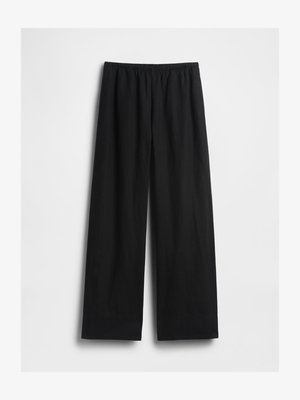 Pantalon noir à jambes larges avec une ceinture élastique, présenté à plat sur fond blanc.