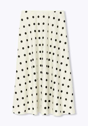 Jupe midi blanche en ligne A avec de grands pois noirs espacés uniformément et une taille ajustée.