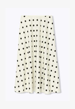 Jupe midi blanche en ligne A avec de grands pois noirs espacés uniformément et une taille ajustée.