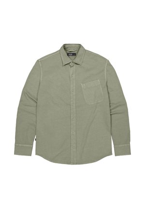 Lichtgroen overhemd met lange mouwen, gemaakt van zacht materiaal; beschikt over een borstzak en contrasterende stiksels op de schouders.