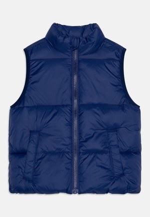 Veste sans manches matelassée bleu marine avec fermeture éclair avant et deux poches latérales, conçue pour la chaleur et un port décontracté.