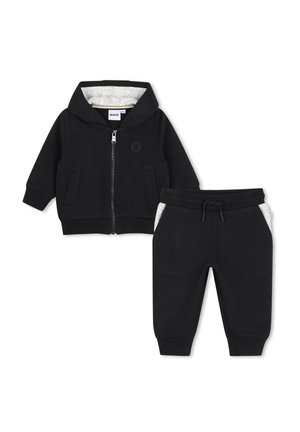 Veste à capuche zippée taille tout-petit noire et pantalon assorti à cordon avec détails en tissu intérieur gris clair.