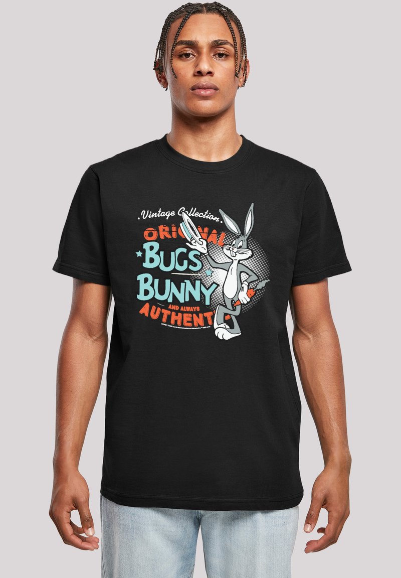 Svart bomull t-skjorte med et fargerikt grafikk av Bugs Bunny med teksten "Vintage Collection" og "Original Bugs Bunny" i fet skrift.