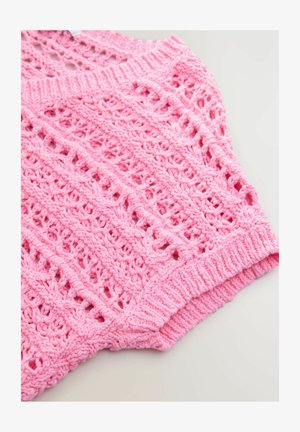 Pink knitted top featuring an openwork design with a ribbed neckline and hem. The texture is soft with a lightweight appearance.