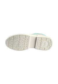 Semelle de chaussure avec une surface en caoutchouc blanc texturée, présentant un motif en forme de feuille pour l'adhérence, avec une légère courbure vers l'avant.