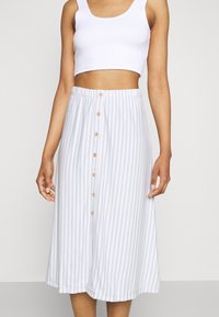 Light blue and white striped midi skirt with an elastic waistband and wooden button front closure, made of a soft, lightweight fabric.