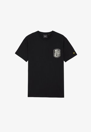 Zwarte katoenen t-shirt met ronde hals, voorzien van een witte logo patch op de linkerborst en een geel embleem op de rechtermouw.