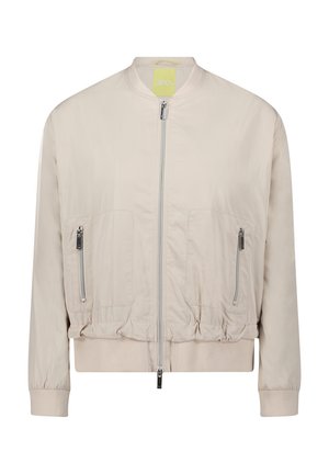 Veste bomber beige clair avec fermeture éclair avant, deux poches zippées, poignets et ceinture élastiques.