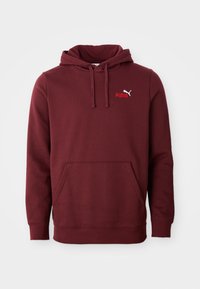 Hoodie Puma bordeaux avec poche kangourou à l'avant, capuche réglable avec cordon de serrage et petit logo Puma sur la poitrine gauche.