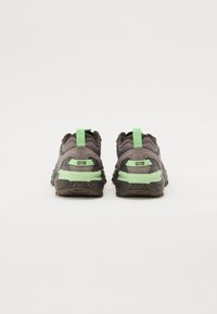 Gray and green athletic shoes with a textured design, featuring a padded collar, rubber sole, and a rear pull tab for easy wear.