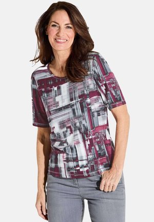 Chemise à manches courtes avec un motif abstrait multicolore en bordeaux, gris et blanc. Tissu doux avec un col rond et une coupe décontractée.