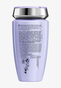 Lila Shampoo-Flasche mit silbernem Deckel, 250 ml, mit Sicherheitshinweisen, Inhaltsstoffen und Gebrauchsanweisung auf dem hinteren Etikett.