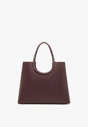Sac cabas en cuir marron à la forme trapézoïdale large, poignées arrondies et surface lisse et unie, présenté sur fond blanc.