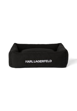Black pet bed featuring plush fabric, a rectangular shape, raised sides, and white "KARL LAGERFELD" logo on one side. Soft, cushioned interior.