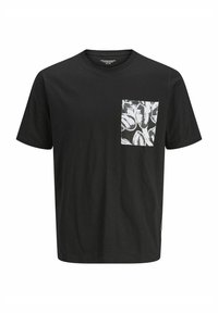 T-shirt en coton noir à manches courtes avec une poche décorée de motifs blancs sur le côté gauche. Encolure ronde et étiquette de marque discrète sur le côté.