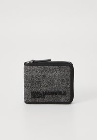 Black and grey zippered wallet in a textured fabric, featuring embossed brand logo, rectangular shape, and visible zipper detail.