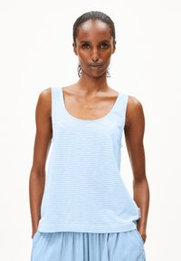 Light blue striped tank top made of soft fabric, featuring a round neckline and wide straps, paired with a light blue skirt.
