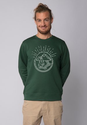 Groen sweatshirt met een ronde grafiek van bergen en een boom. Zachte textuur, ronde hals en lange mouwen. Casual pasvorm.
