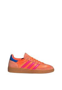 Orange suede sneaker with pink stripes, blue accents, and brown rubber sole. Features a classic design with a lace-up closure.