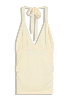 Krém színű ujjatlan nyakpántos ruha mély V-nyakkivágással és hátul, a nyaknál megkötős záródással.