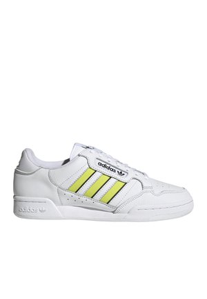 Hvide lædersneakers med tre lodrette gule og sorte striber, perforerede detaljer på tåen og gummisål. Har brandlogo på siden.