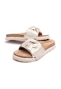 Metallic gold slide sandals with knotted strap design, cushioned insole, cork-like midsole, and textured rubber outsole.