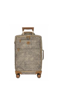 Valise à roulettes en tissu beige texturé avec des accents marron. Elle est équipée d'une poignée rétractable et d'une poche zippée à l'avant pour un accès facile.