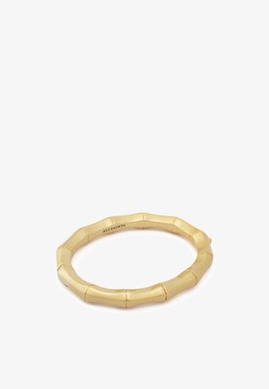 Bracciale rigido placcato oro a forma di bambù con segmenti lisci e sfaccettati e incisione "ALLSAINTS" all'interno.