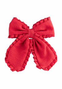 Un nœud en tissu rouge vif avec des bords ondulés, placé au centre, mettant en valeur la texture et le volume, adapté à un usage décoratif ou formel.