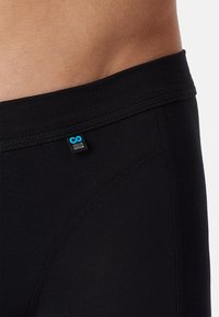 Zwarte katoen boxershorts met een zachte tailleband en gestikte naden. Voorzien van een logo tag in het blauw met de tekst "Lifesyle Cotton."