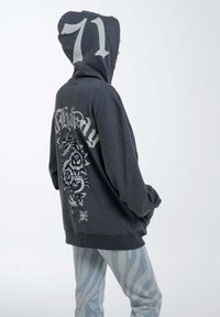 Dark gray hoodie with large white number "71" on the hood and intricate dragon and rose graphic on the back. Relaxed fit with ribbed cuffs.