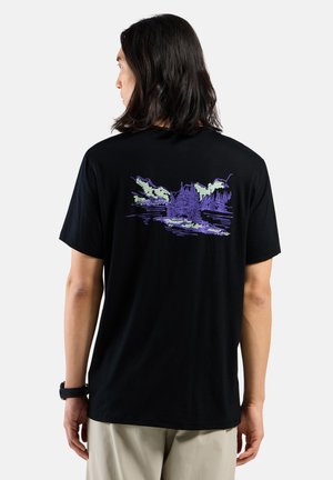 Black cotton t-shirt featuring a purple nature-themed graphic on the back, depicting trees and mountains against a water backdrop.