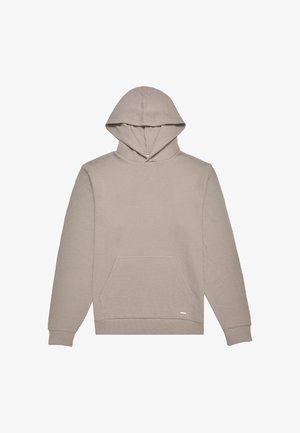 Hettegenser i lys beige, laget av et teksturert stoff, med lange ermer og en lomme foran. Har ribbede mansjetter og kant.