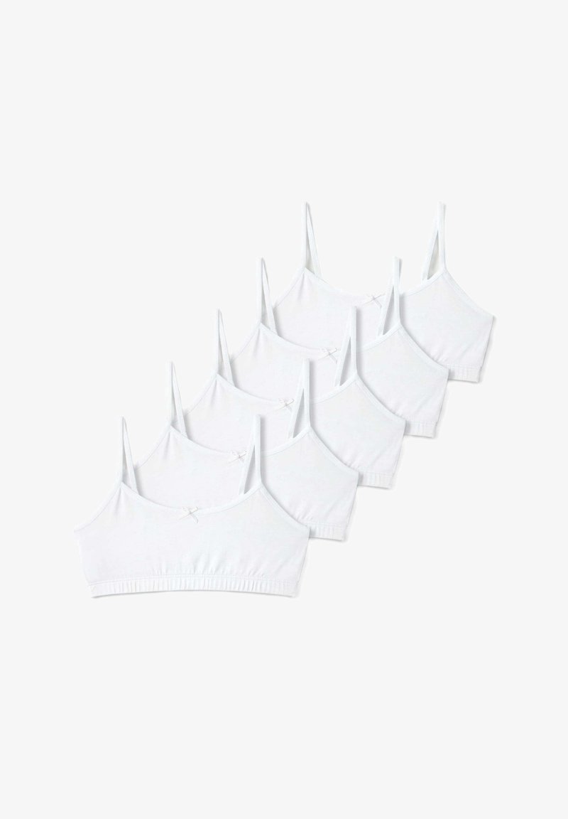 Conjunto de seis bralettes de algodón blanco que cuentan con tirantes ajustables, una textura suave y un pequeño lazo en el centro delantero.