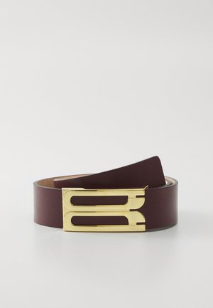Burgundy leather belt featuring a gold-tone metal buckle with a streamlined design and dual cutout accents. Smooth texture, minimal embellishments.