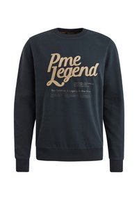 Tamno plavi dukserica od mekog materijala s velikim zlatnim natpisom "Pme Legend" i dodatnim ispisanim detaljima ispod. Pletiva na rukavima i donjem rubu.