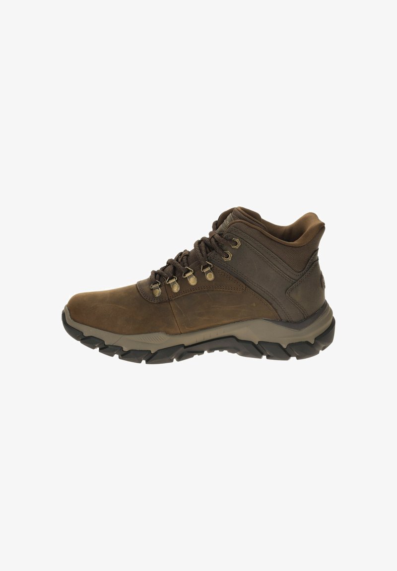 Brown mid-top hiking boot with leather and textile materials, featuring metal eyelets and rugged rubber sole, designed for outdoor use.