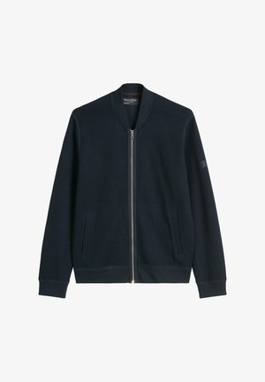 Marineblaue Bomberjacke mit einem vorderen Reißverschluss, Seitentaschen, gerippten Bündchen und einem runden Halsausschnitt. Hergestellt aus einem strukturierten Stoff.